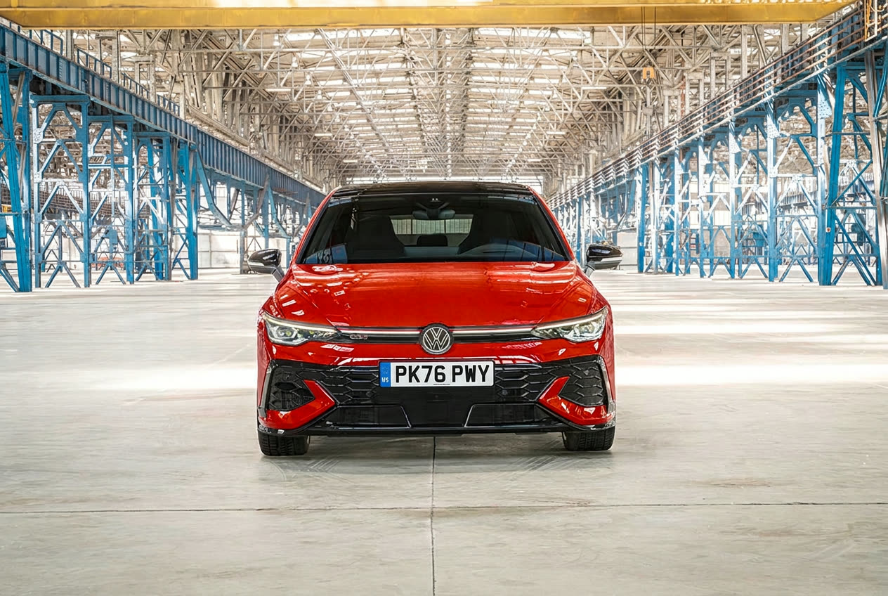 Front view of a red Volkswagen Golf GTI Edition 50 with LED light strip and honeycomb grille