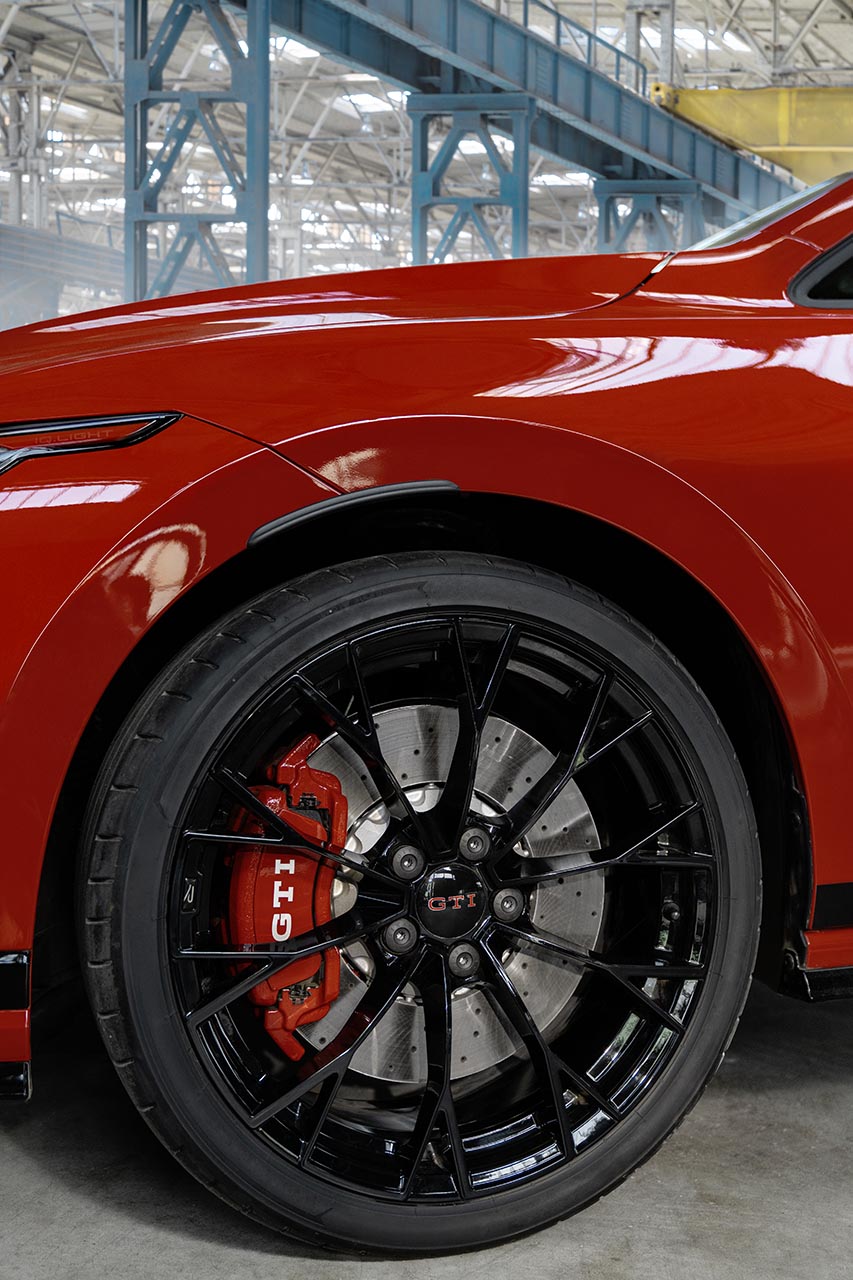 Close-up of a black alloy wheel with a GTI centre cap and red brake caliper on the Golf GTI Edition 50