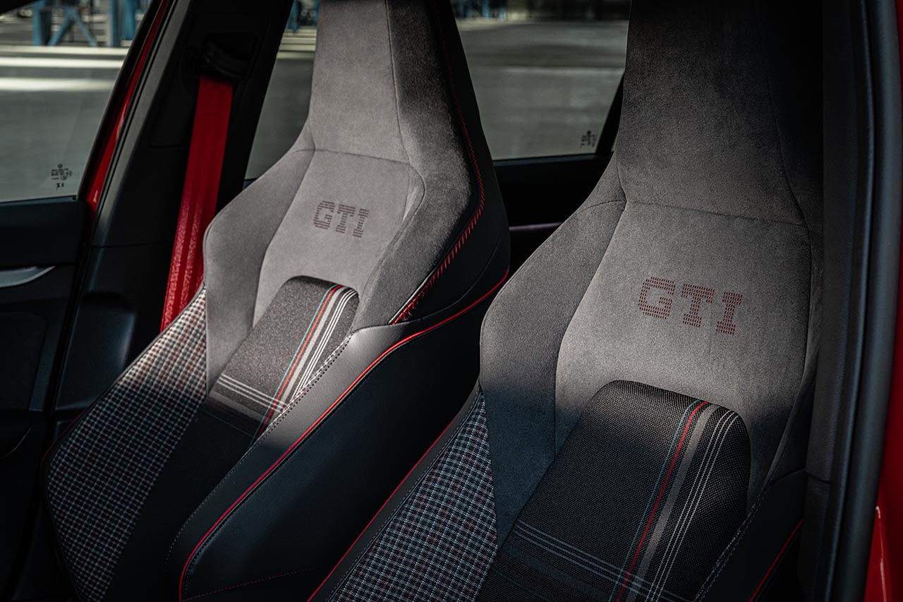 Front sports seats of the Golf GTI Edition 50 with GTI embossing, tartan centres and red stitching